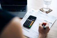 Woman reviewing finances at her desk