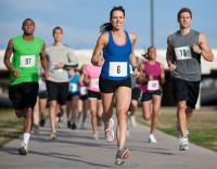 Group of runners in a race. West Financial Services.