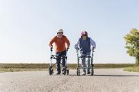 Two older men racing walkers