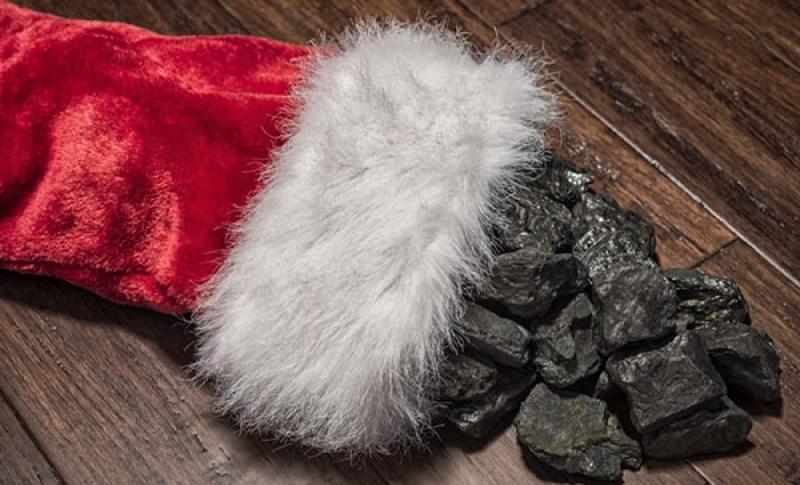Red stocking with coal in it. West Financial Services.