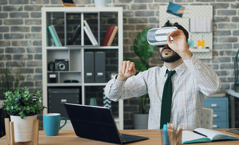 Man looking through VR. West Financial Services.
