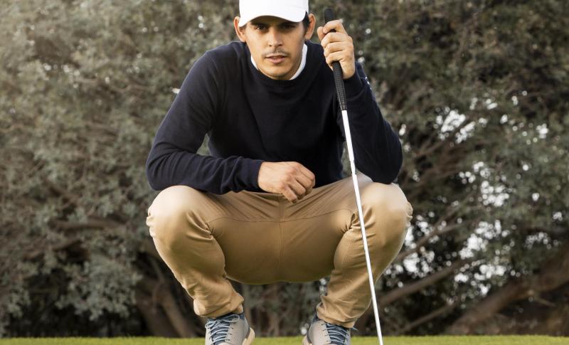 Golfer looks at his putt