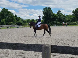 Waitara, a horse, and a rider. West Financial Services.